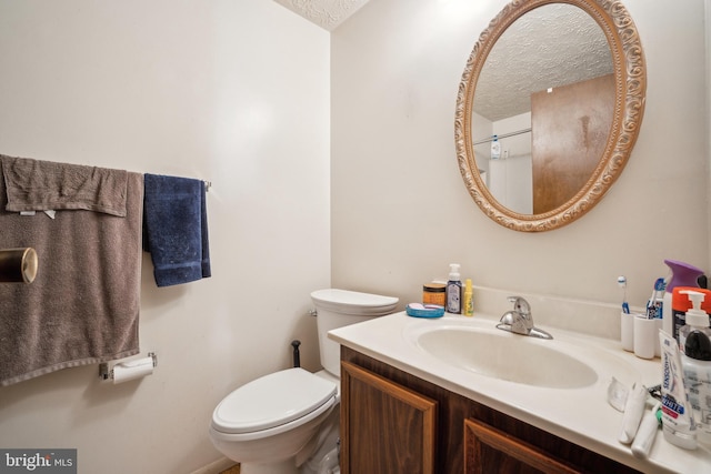 997 Heather Ridge Dr Unit 3G, Frederick, MD 21702 - bathroom with a textured ceiling, vanity, and toilet