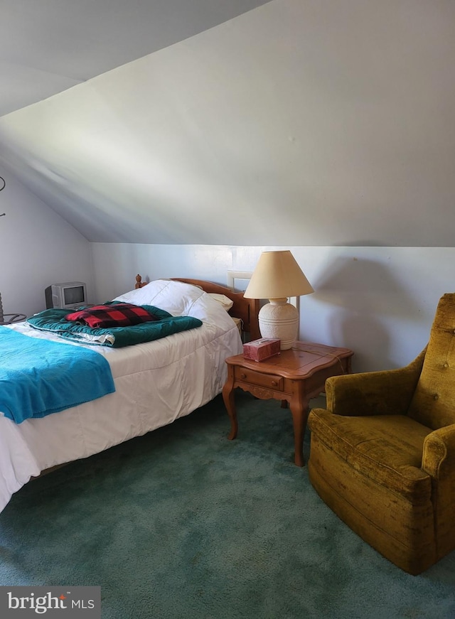 carpeted bedroom featuring vaulted ceiling