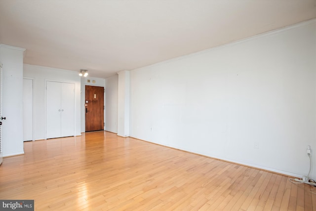 400 Madison St Unit 1704, Alexandria, VA 22314 - unfurnished room with ornamental molding and light wood finished floors