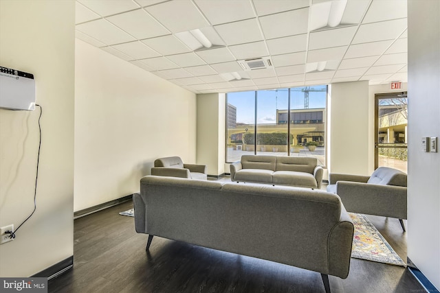 400 Madison St Unit 1704, Alexandria, VA 22314 - living area with a paneled ceiling, dark wood-style flooring, baseboards, and visible vents