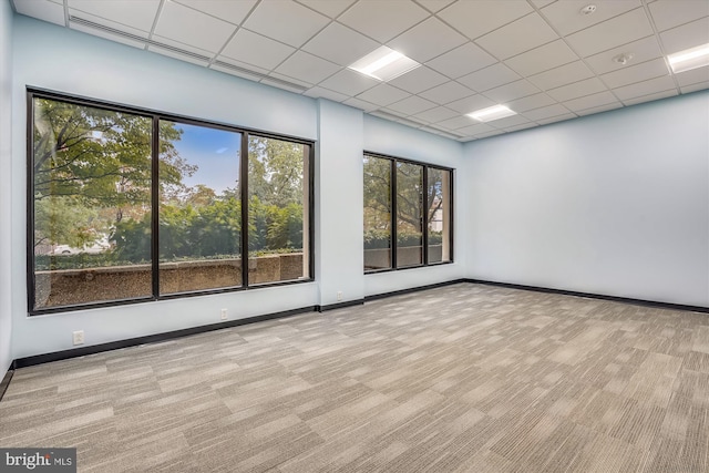 400 Madison St Unit 1704, Alexandria, VA 22314 - carpeted spare room featuring baseboards and a paneled ceiling