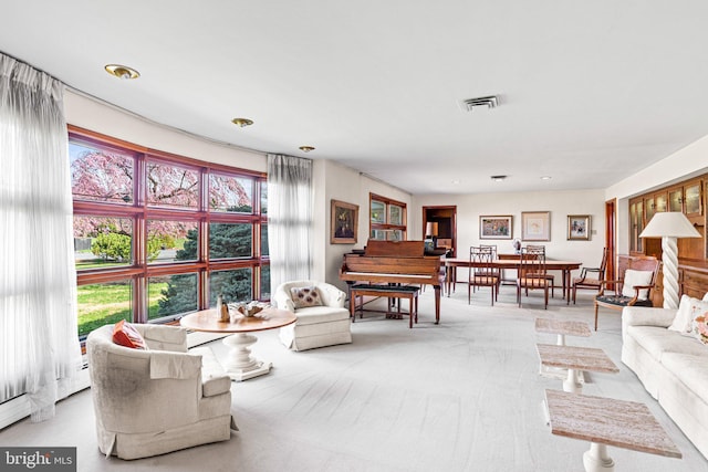 carpeted living room with visible vents