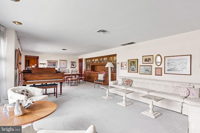 carpeted living room with visible vents