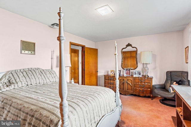 bedroom featuring carpet flooring and visible vents