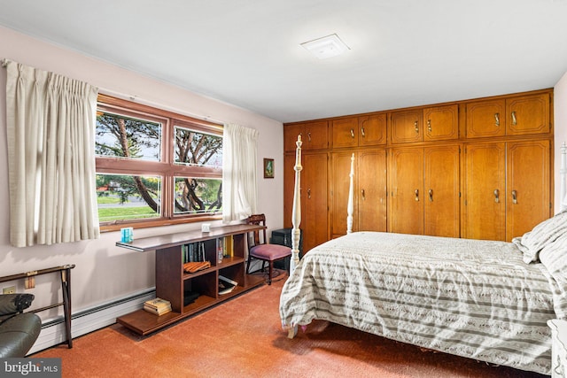 bedroom featuring a baseboard radiator, carpet flooring, and a closet