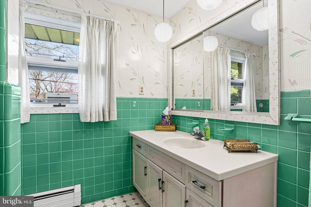 bathroom featuring a wainscoted wall, wallpapered walls, vanity, and a baseboard radiator