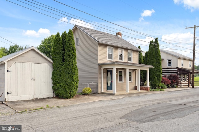 306 W Chapline St, Sharpsburg, MD 21782 - view of front of house with a storage shed, a chimney, a porch, and a metal roof