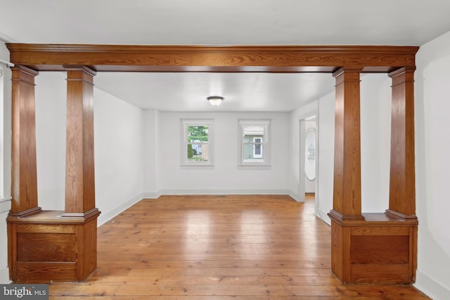306 W Chapline St, Sharpsburg, MD 21782 - unfurnished room with decorative columns and hardwood / wood-style flooring