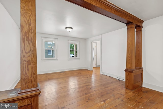 306 W Chapline St, Sharpsburg, MD 21782 - unfurnished living room with hardwood / wood-style flooring and ornate columns