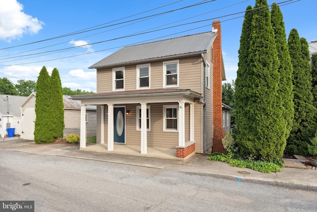 306 W Chapline St, Sharpsburg, MD 21782 - view of front of home with a porch, a chimney, and a metal roof