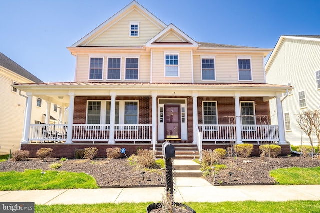 5 Susannah Dr, Chesterfield, NJ 08515 - view of front of house with covered porch, brick siding, and a standing seam roof