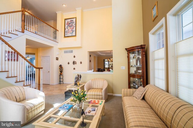 5 Susannah Dr, Chesterfield, NJ 08515 - carpeted living area featuring a high ceiling, stairs, visible vents, and crown molding