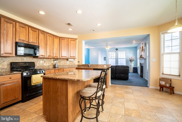 5 Susannah Dr, Chesterfield, NJ 08515 - kitchen featuring visible vents, black appliances, decorative backsplash, and a kitchen island