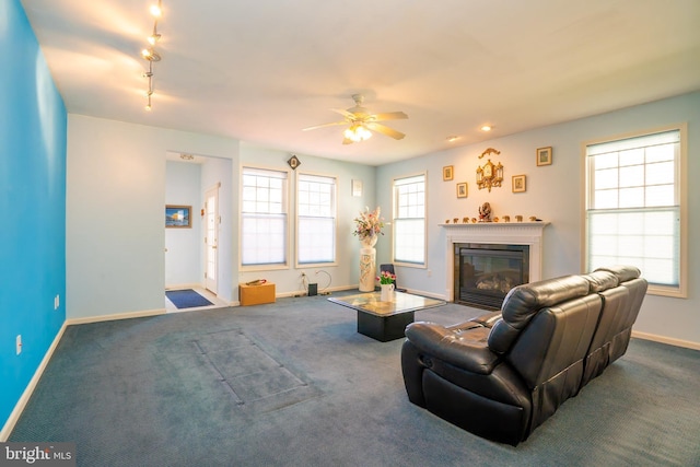 5 Susannah Dr, Chesterfield, NJ 08515 - carpeted living room with baseboards, ceiling fan, a glass covered fireplace, and rail lighting