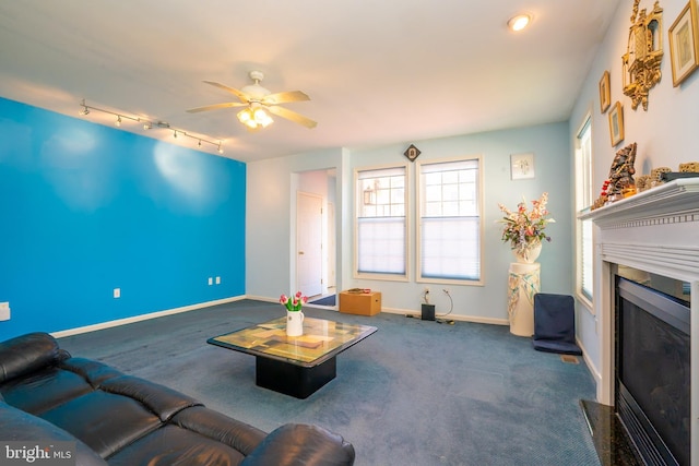 5 Susannah Dr, Chesterfield, NJ 08515 - carpeted living area with rail lighting, a glass covered fireplace, baseboards, and ceiling fan