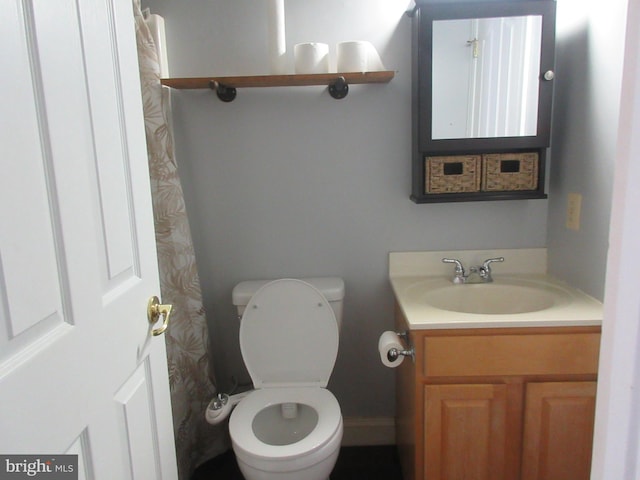 full bathroom with vanity and toilet