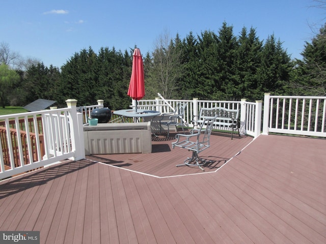 wooden deck with outdoor dining space