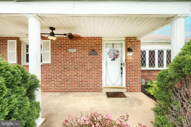 14 Longview Rd, Seven Valleys, PA 17360 - view of exterior entry with a ceiling fan and brick siding