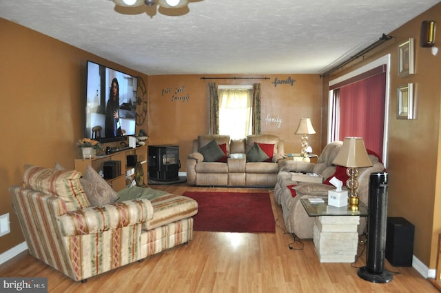14 Longview Rd, Seven Valleys, PA 17360 - living area featuring a textured ceiling, wood finished floors, baseboards, and ceiling fan