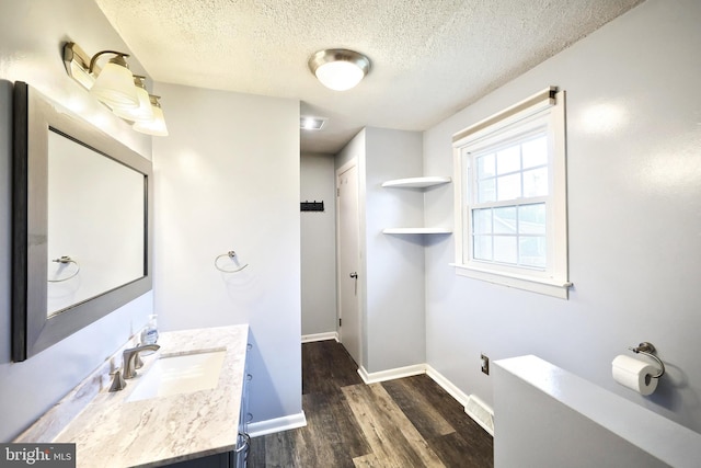 14 Longview Rd, Seven Valleys, PA 17360 - bathroom featuring baseboards, vanity, a textured ceiling, and wood finished floors