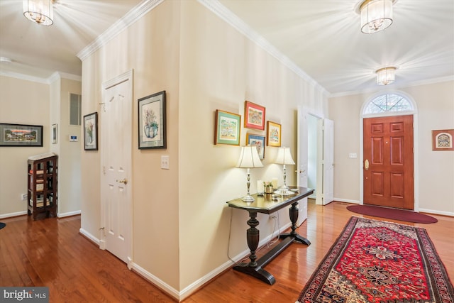 7906 Plum Creek Dr, Gaithersburg, MD 20879 - foyer entrance with wood finished floors, crown molding, and baseboards
