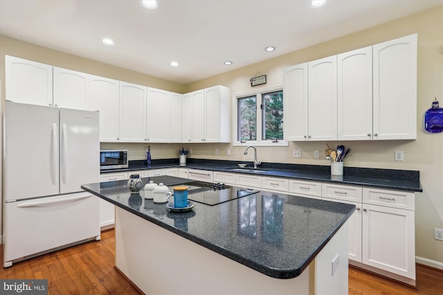 7906 Plum Creek Dr, Gaithersburg, MD 20879 - kitchen with freestanding refrigerator, stainless steel microwave, a sink, white cabinets, and recessed lighting