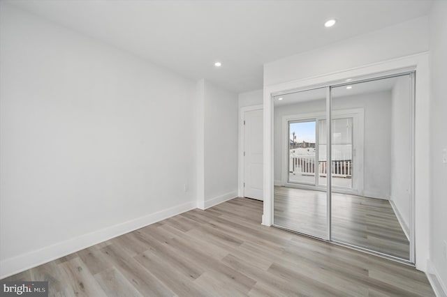 2811 C St, Philadelphia, PA 19134 - unfurnished bedroom featuring recessed lighting, light wood finished floors, baseboards, and access to exterior