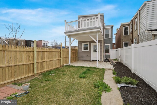 2811 C St, Philadelphia, PA 19134 - rear view of property featuring a patio area, a fenced backyard, and a lawn