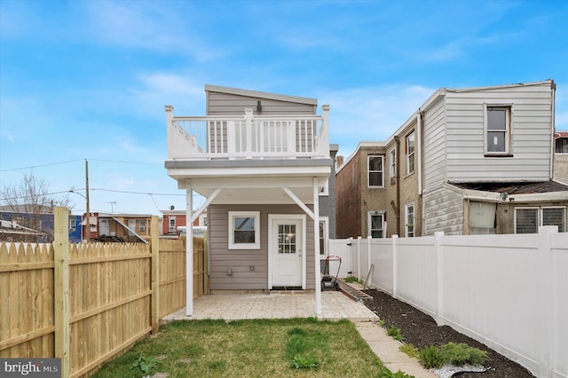 2811 C St, Philadelphia, PA 19134 - back of property with a patio area, a fenced backyard, a yard, and a balcony