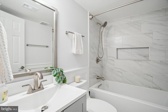 bathroom with  shower combination, vanity, visible vents, and toilet