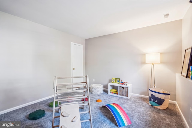 rec room with carpet floors, baseboards, and visible vents