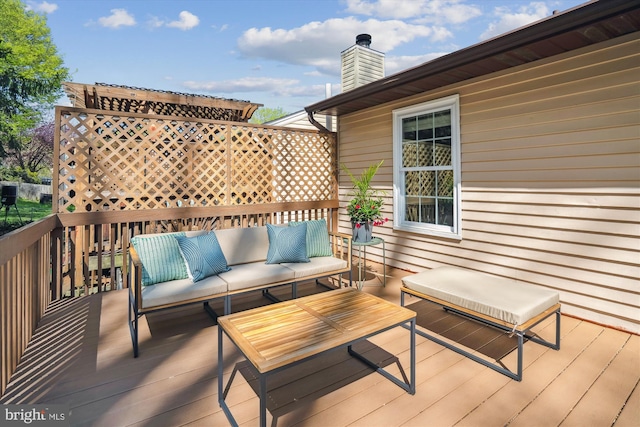 wooden deck featuring an outdoor living space