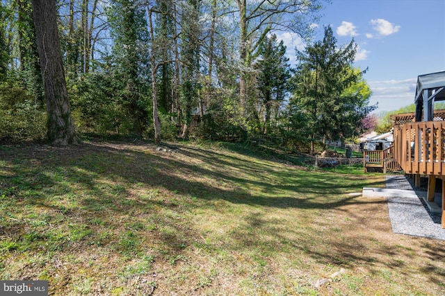 view of yard with a deck