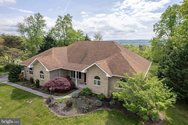 237 Aspen Trl, Winchester, VA 22602 - view of front of house featuring a shingled roof, a front yard, and brick siding