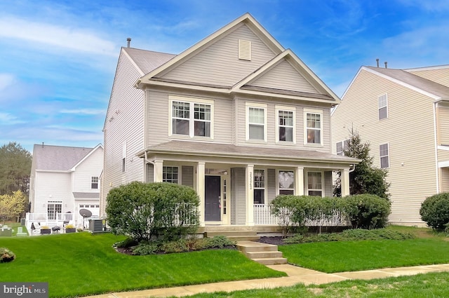 view of front of house with a porch, central air condition unit, and a front lawn