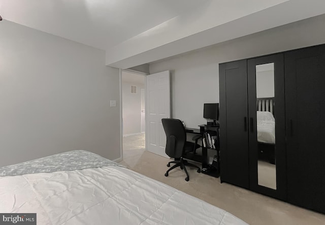 bedroom featuring visible vents and light colored carpet