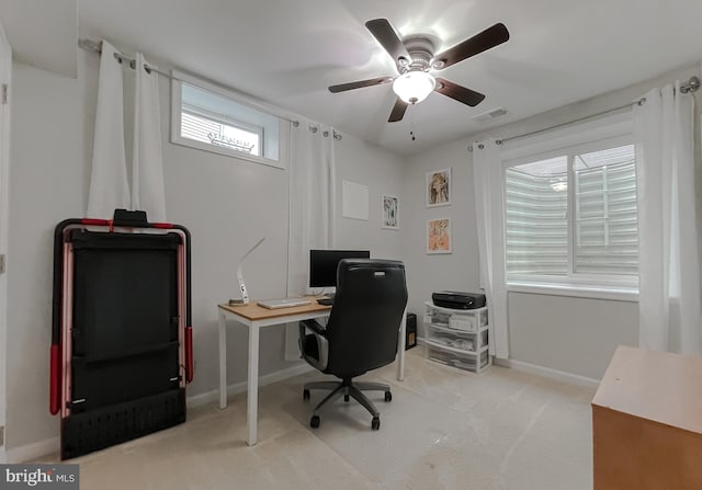 office featuring visible vents, ceiling fan, baseboards, and carpet floors