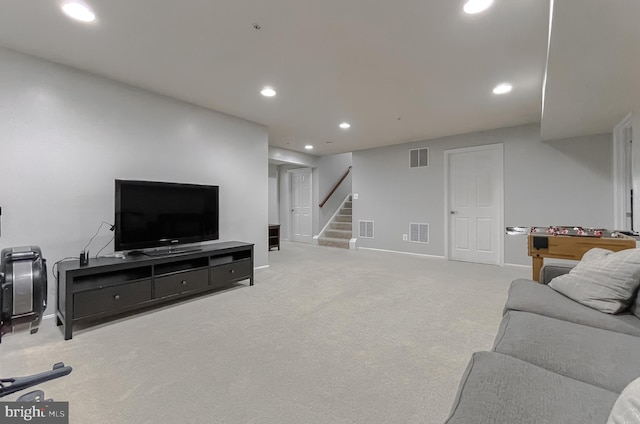 living room with visible vents, recessed lighting, and stairs
