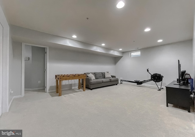 living room featuring recessed lighting, baseboards, and carpet floors