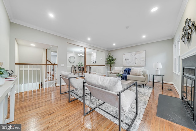 3568 S George Mason Dr Unit 12, Alexandria, VA 22302 - living room with light wood-type flooring, recessed lighting, stairs, and ornamental molding
