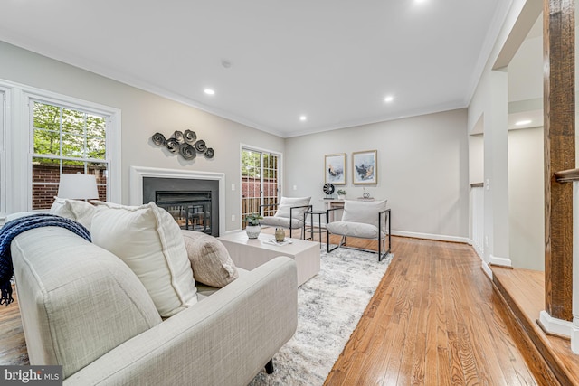 3568 S George Mason Dr Unit 12, Alexandria, VA 22302 - living room featuring a glass covered fireplace, light wood finished floors, baseboards, ornamental molding, and recessed lighting