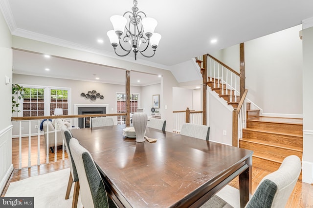 3568 S George Mason Dr Unit 12, Alexandria, VA 22302 - dining room featuring recessed lighting, stairway, a fireplace, light wood-style floors, and a chandelier