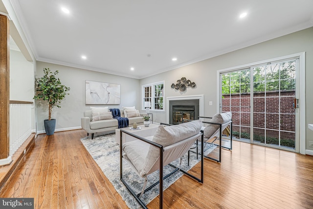 3568 S George Mason Dr Unit 12, Alexandria, VA 22302 - living area featuring recessed lighting, crown molding, a glass covered fireplace, and light wood-style flooring