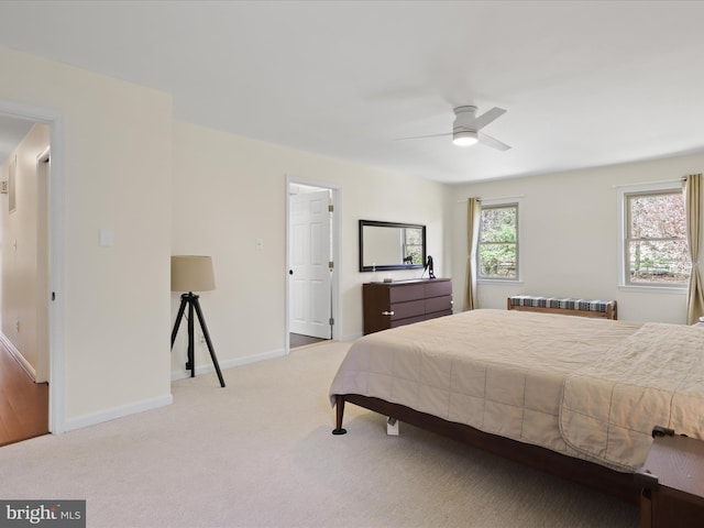 bedroom featuring baseboards, a ceiling fan, and carpet floors