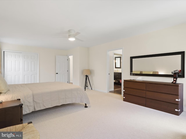 bedroom with carpet flooring, a closet, baseboards, and ceiling fan
