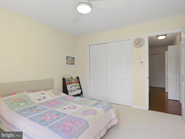 bedroom featuring a closet, baseboards, ceiling fan, and carpet floors