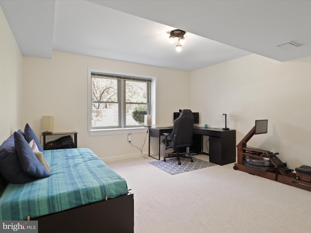 carpeted bedroom with visible vents and baseboards