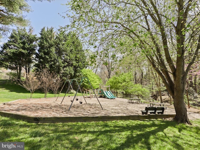 community jungle gym featuring a yard