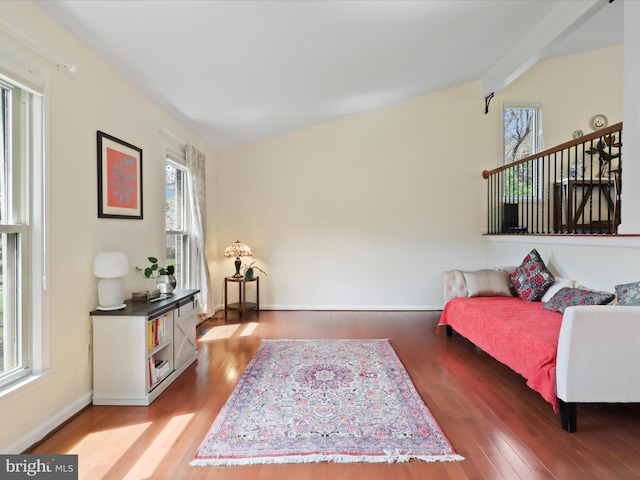 living area with wood finished floors and baseboards