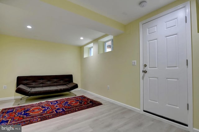 sitting room featuring wood finished floors, baseboards, and recessed lighting